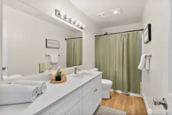 Updated bathroom with spacious new quartz countertop