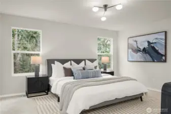 This primary suite is the retreat every owner is looking for. Windows look out to the forest that provides year round privacy.