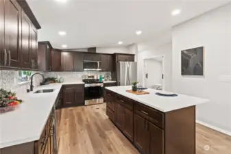 Kitchen w/New Laminate Floors, White Millwork and Doors.