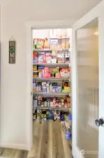 Walk in pantry in kitchen with lots of roome for storage.