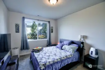 Bedroom #2 with high ceilings.