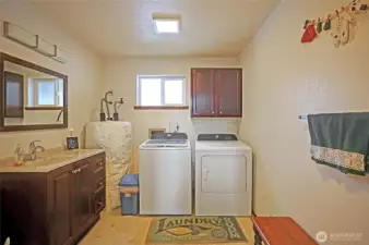 Lower lever 3/4 bath and utility room. Washer and dryer do stay with the property as well.