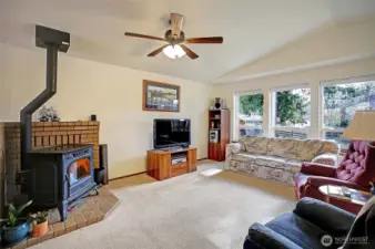 This living room is filled with tons a of natural light flooding in through the updated windows and the cozy pellet stove is sure to keep you toasty & warm on our cold Winter nights.