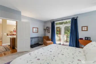 Another set of pretty french doors provide access outside to your own private deck for that morning or evening beverage!