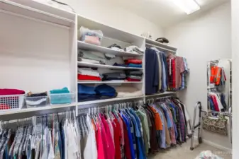 This enormous walk-in closet with tons of built-ins has room for everything!