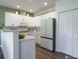 Slick refrigerator has interior water dispenser.
