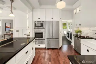 Induction stove with down draft, gorgeous high end appliances, custom lighting, farmhouse sinnk, custom cabinets and upgraded wiring and plumbing.