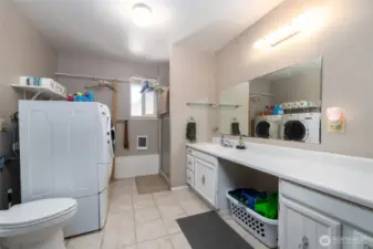 3/4 bath with laundry facilities and storage on