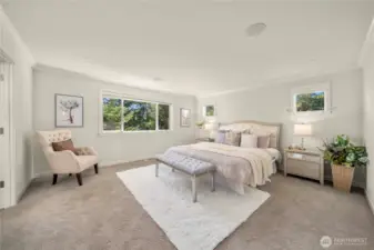 Upstairs primary suite with spa-inspired 5-piece bath and spacious walk-in closet