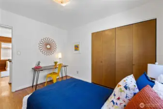 View of second bedroom looking toward hall and family room.
