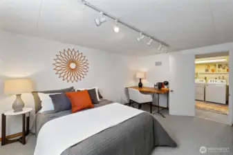 Lower level bedroom looking toward laundry/flex space.