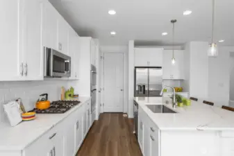 This kitchen is in beautiful condition and has a lot of storage! Love the gas range.