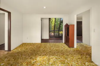 Dining room with powder room in hallway