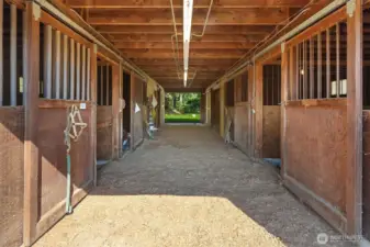 Center aisle with tack room and grooming bay