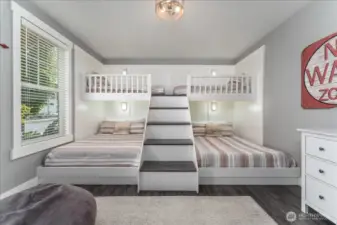 Main floor Bunk Room with twin over queen sized beds.