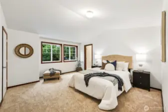 The primary suite is well appointed with two closets one walk in and an en-suite bathroom. The windows are North East Facing with morning filtered light.