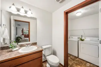 The laundry room is just off the half bathroom on the main floor. The ease of location comes off the garage creating a drop zone as you enter the house.