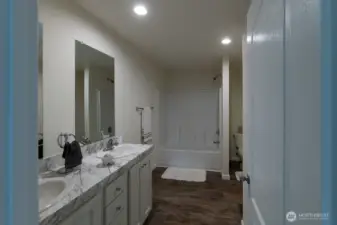 Primary bath with dual sinks and tub with shower