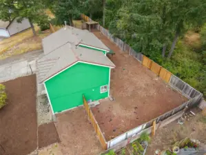 Enjoy a spacious, fully fenced yard surrounded by mature evergreens—offering privacy, shade, and endless potential. Whether you envision a garden, play space, or outdoor entertaining area, this generous lot provides the perfect blank slate to make it your own.