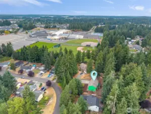 Ideally positioned in a peaceful cul-de-sac and backed by tall evergreens, this home sits just moments from local schools, parks, and community amenities. The aerial perspective highlights the home’s convenient proximity while still offering privacy and natural surroundings—an excellent blend of comfort, convenience, and Northwest living