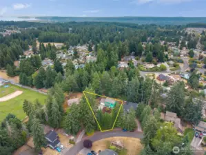 Ideally positioned in a peaceful cul-de-sac and backed by tall evergreens, this home sits just moments from local schools, parks, and community amenities. The aerial perspective highlights the home’s convenient proximity while still offering privacy and natural surroundings—an excellent blend of comfort, convenience, and Northwest living