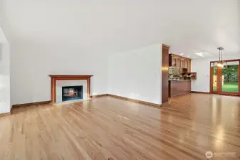 Family room with see through fireplace into living room.