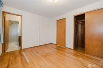 Primary bedroom closet with cedar lining