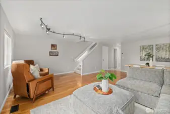 A view towards the stairs. The 1/2 bath is conveniently located.