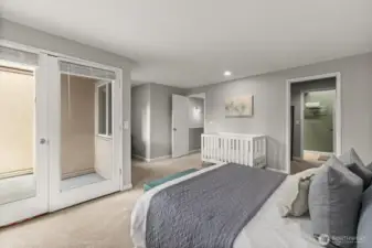 A view towards the balcony and also looking towards the walk-in closet.