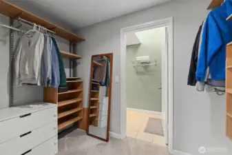 The primary's walk-in closet looking towards the bathroom.