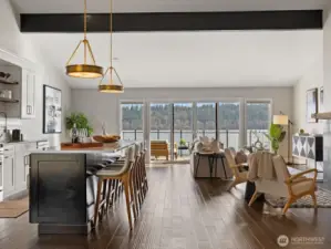 Open-concept living and dining area with hardwood flooring, vaulted ceilings, and large windows with Lake Sammamish views