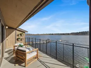 Private deck with Lake Sammamish waterfront views, railing, and outdoor seating overlooking community dock
