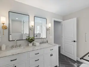 Bathroom with double vanity, stone countertops, and tile flooring