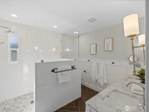 Bathroom with walk-in shower, tile surround, and glass enclosure