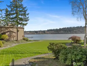 Community waterfront lawn with landscaped grounds, walking paths, and Lake Sammamish shoreline access