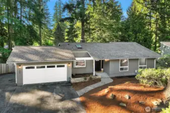 A beautifully updated ranch-style home with a brand-new roof and fresh exterior paint offers exceptional curb appeal, framed by mature evergreen trees on a fully fenced private lot. The spacious 2,615 sq ft layout, detached garage, and prime location minutes from Beaver Lake and scenic trails make this a truly outstanding opportunity.