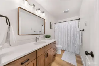 This is the bathroom for the upstairs bedrooms. Very clean and modern.