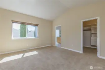 Primary bedroom with walk-in closet and private bath