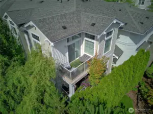 Lush foliage surround the condo's private balcony