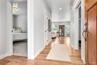 Inviting front entry w/wide halls; 2nd/3rd bdrms and full bath to left, large utility room to right
