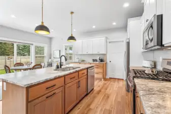 Plenty of storage with tons of cabinets. Gas stove & large sink