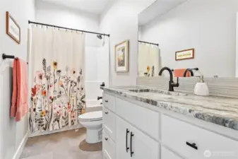 Full bath by 2nd & 3rd bedrooms w/lovely granite & tile flooring