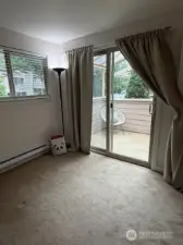 Streetside bedroom has a private deck...