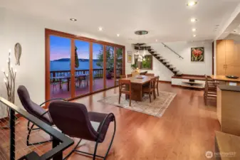 Entering your main floor everything is clean lines and eco-friendly materials. The flow of this home welcome friends with open arms and stellar views. Just beyond the kitchen sits a beautiful half bath.