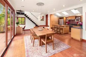 Delightful view of the main floor shows the sun drenched kitchen with plenty of cabinet space room for an office if you please!