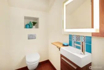 The main floor half bath is gorgeous with European vibes!