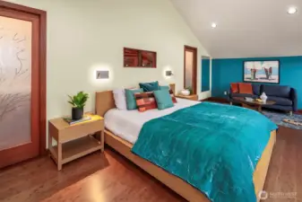 The primary suite is oversized with sitting space (or workout space), a walk in closet and five piece bathroom. Never miss the view, even from the shower!