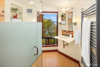 Beautiful bathroom with towel warmer and colorful design.