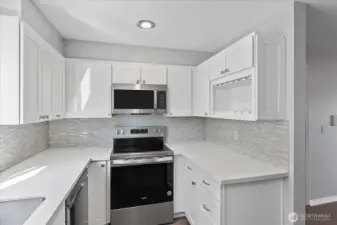 Modern kitchen with built-in wine rack and lots of storage.
