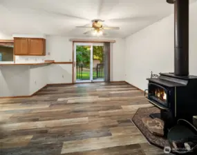 Wood Fireplace next to with view of slider to back yard